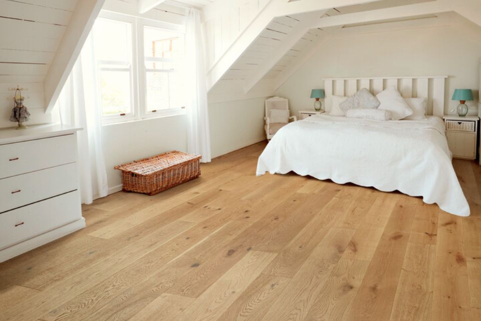 light hardwood flooring in modern farmhouse bedroom